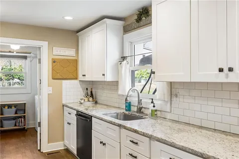 a kitchen with sink and window