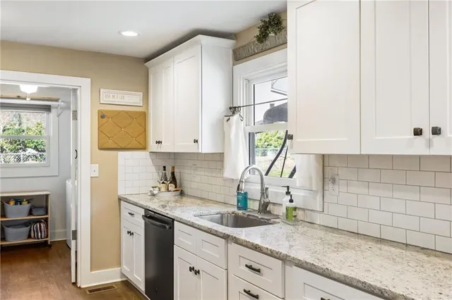 a kitchen with sink and window