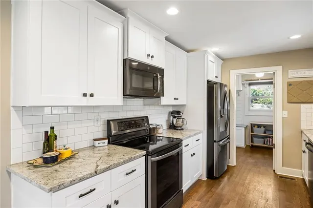 a kitchen with a sink a stove and refrigerator