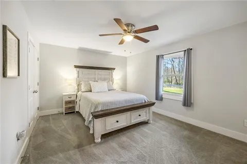 a bedroom with a bed and window