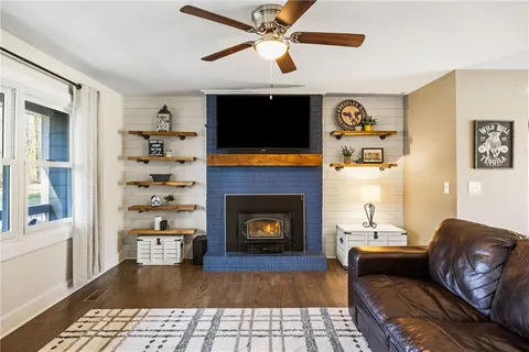 a living room with furniture fireplace and a flat screen tv