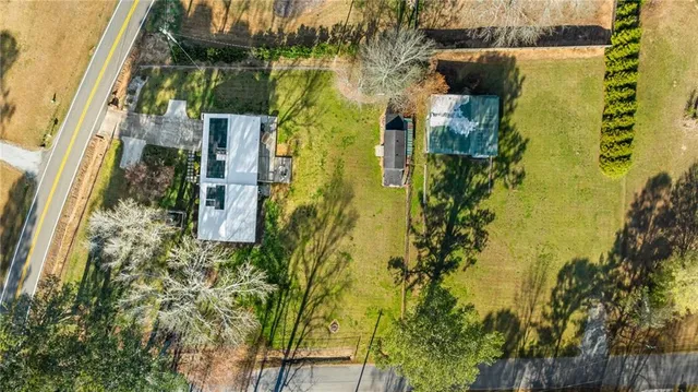 a aerial view of a house with swimming pool