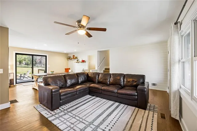 a living room with furniture and a rug