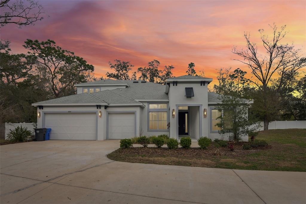 2304 Clement Road Lutz, FL 33549 - Photo 1 of 37 front view of house with a yard