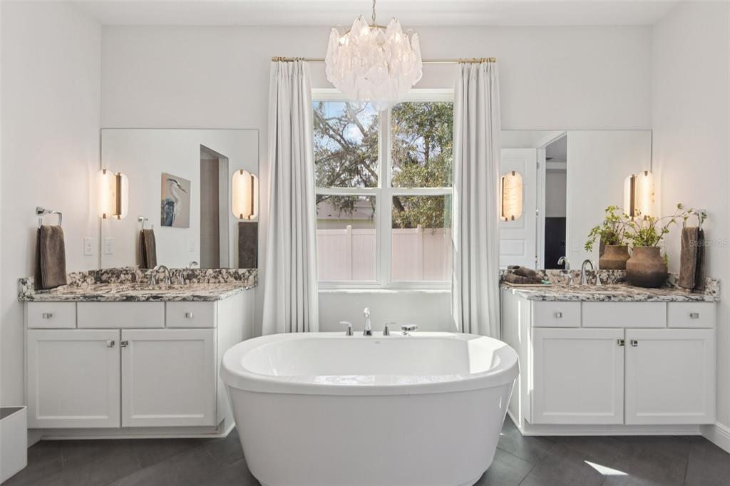 2304 Clement Road Lutz, FL 33549 - Photo 15 of 35 a bathroom with a bathtub and a sink