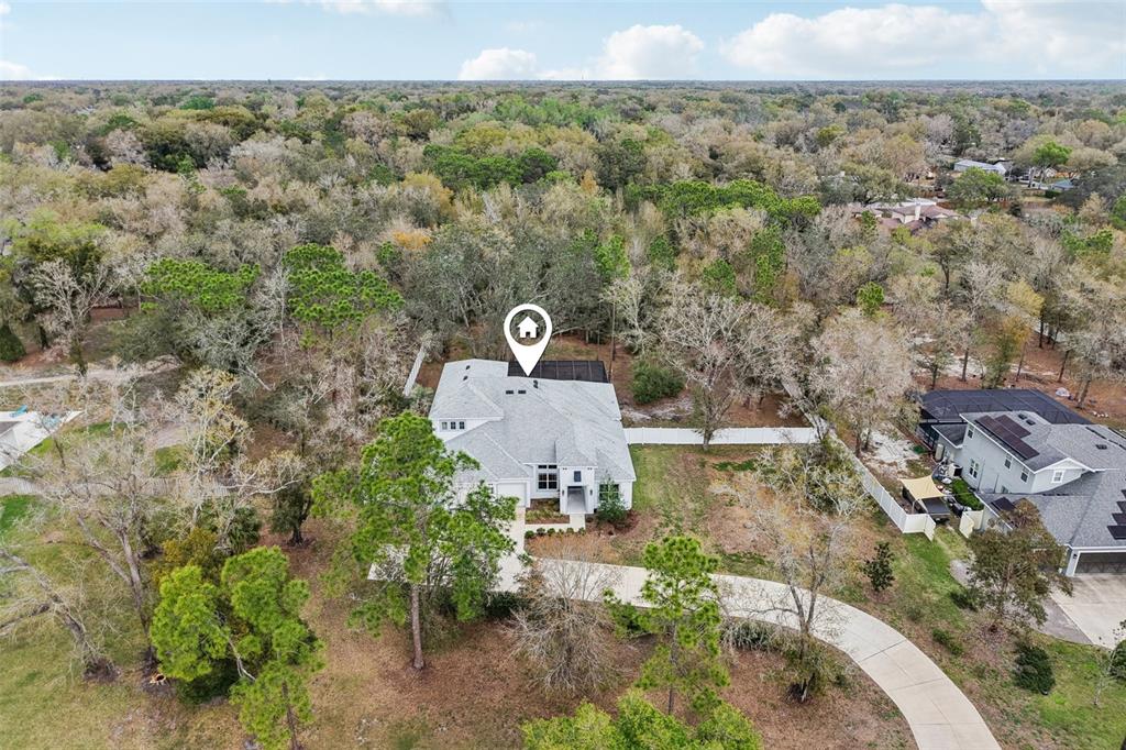 2304 Clement Road Lutz, FL 33549 - Photo 2 of 35 an aerial view of a house with a yard