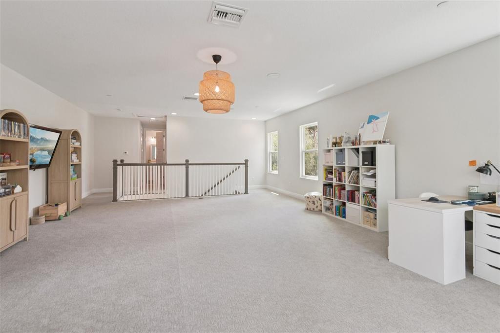 2304 Clement Road Lutz, FL 33549 - Photo 24 of 35 a view of a livingroom with furniture and workspace