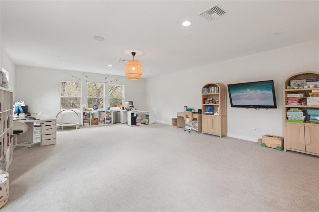 2304 Clement Road Lutz, FL 33549 - Photo 24 of 37 a living room with furniture and a table