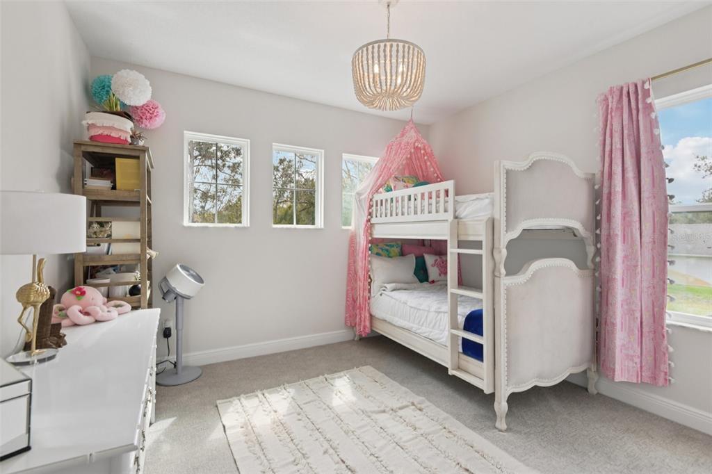 2304 Clement Road Lutz, FL 33549 - Photo 27 of 37 a bedroom with a bed and a window