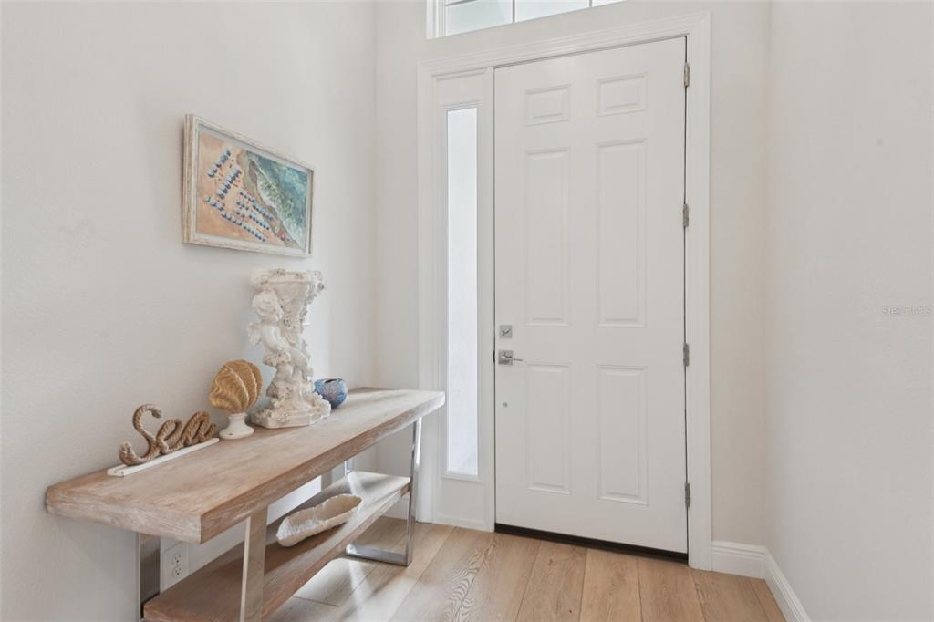 2304 Clement Road Lutz, FL 33549 - Photo 3 of 37 a room with a table and a potted plant