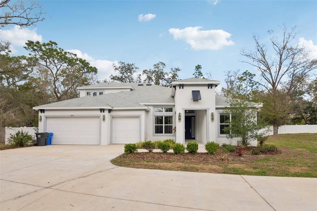 2304 Clement Road Lutz, FL 33549 - Photo 33 of 35 front view of house with a yard