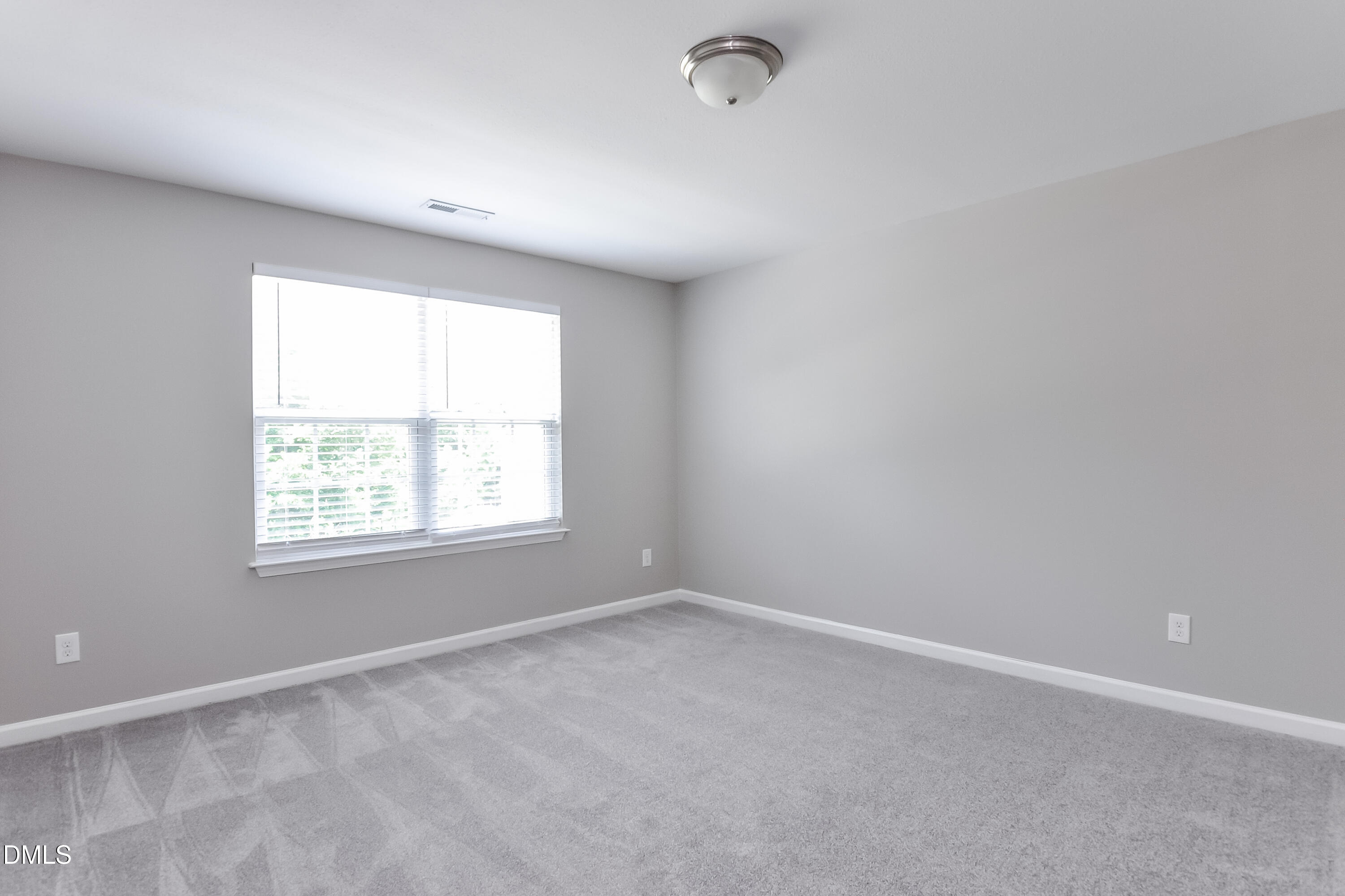817 Leatherstone Lane Fuquay-Varina, NC 27526 - Photo 12 of 17 an empty room with a window