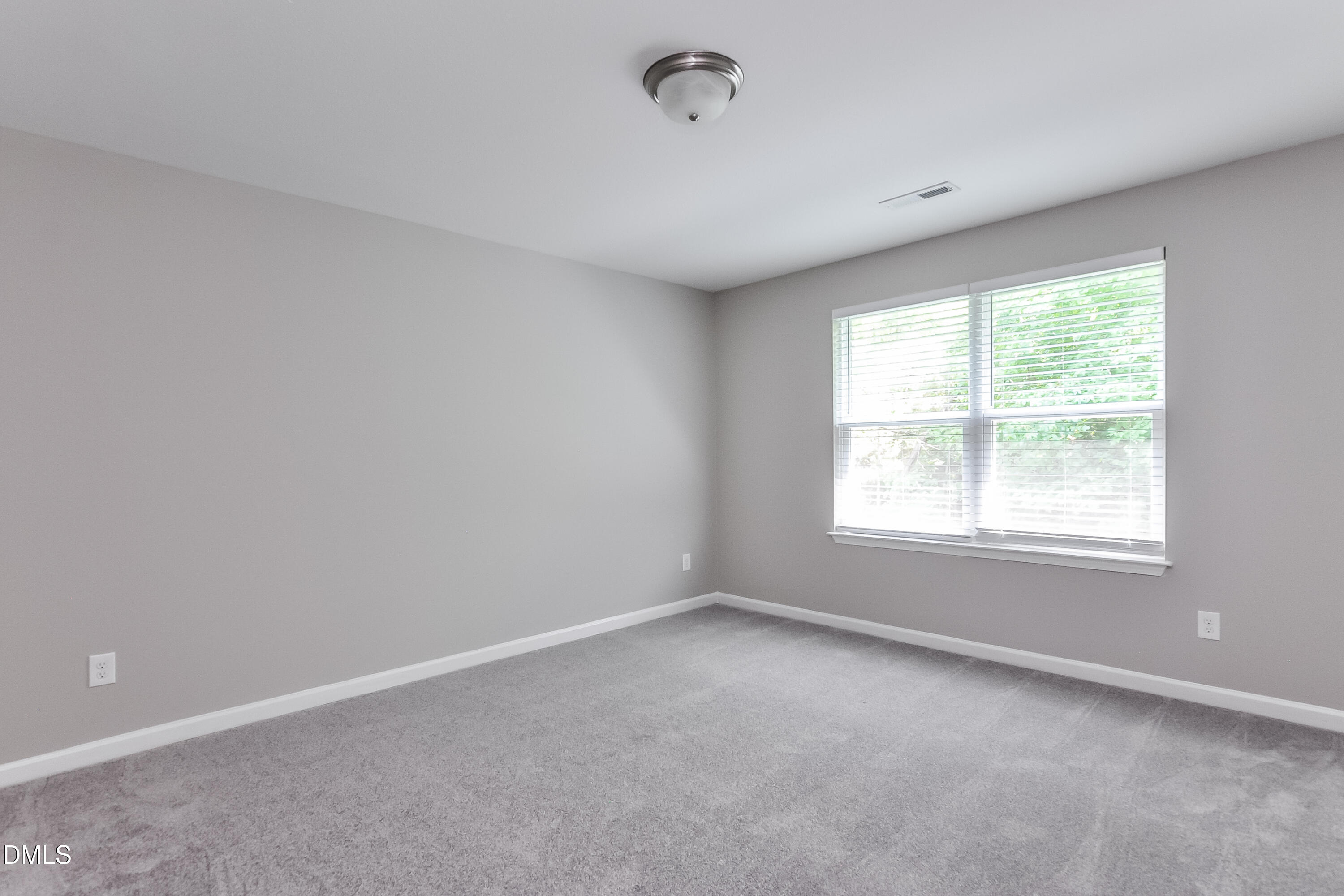 817 Leatherstone Lane Fuquay-Varina, NC 27526 - Photo 13 of 17 an empty room with a window