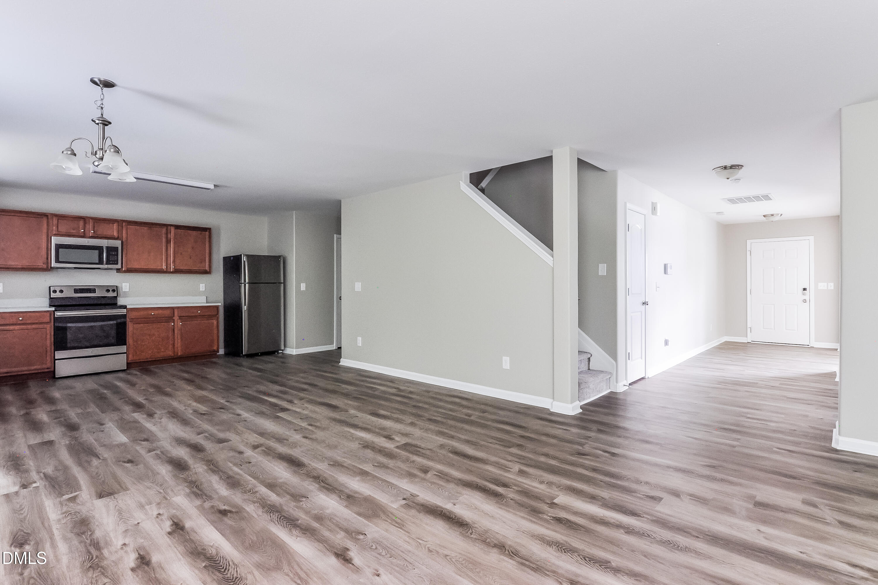 817 Leatherstone Lane Fuquay-Varina, NC 27526 - Photo 7 of 17 a view of a kitchen with a sink and a refrigerator