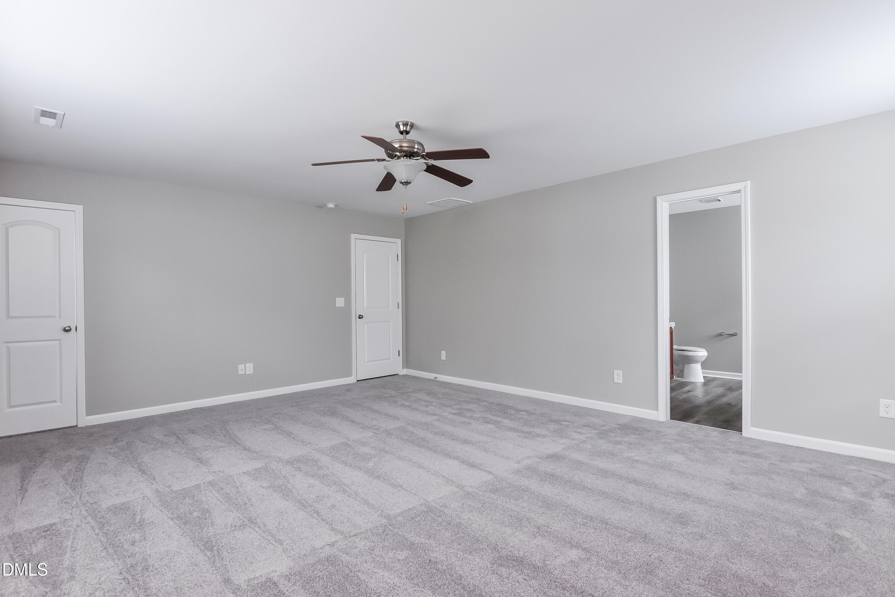 817 Leatherstone Lane Fuquay-Varina, NC 27526 - Photo 10 of 17 a view of an empty room with a ceiling fan