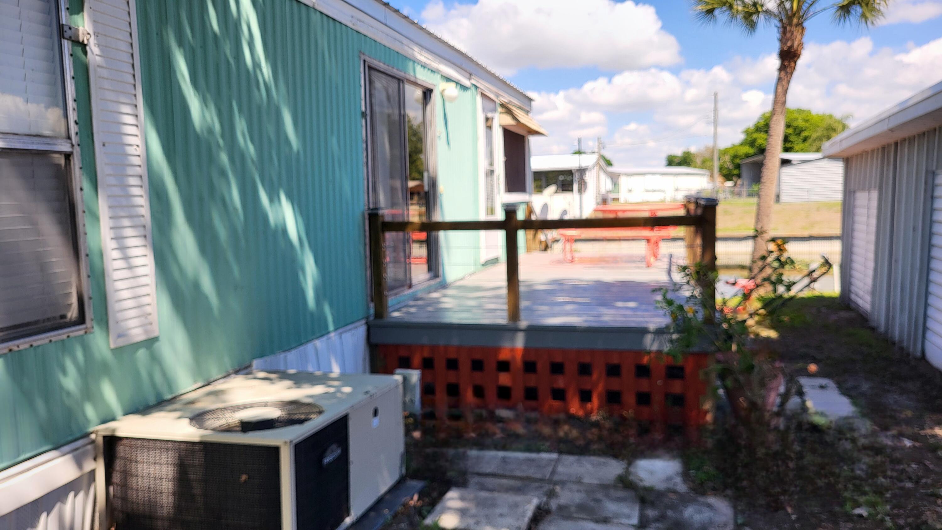 1982 Linda Road Okeechobee, FL 34974 - Photo 6 of 43 a view of a balcony with wooden floor