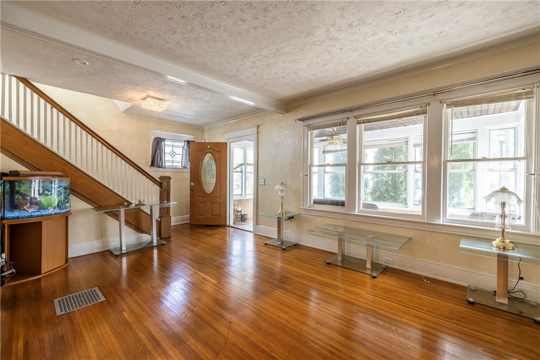 540 Augustine Street Rochester, NY 14613 - Photo 12 of 49 SPACIOUS LIVING ROOM WITH EXPANSIVE WINDOWS & BEAU