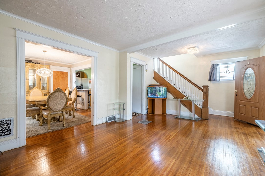 540 Augustine Street Rochester, NY 14613 - Photo 13 of 49 SPACIOUS LIVING ROOM WITH EXPANSIVE WINDOWS & BEAU
