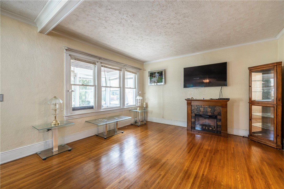 540 Augustine Street Rochester, NY 14613 - Photo 14 of 49 SPACIOUS LIVING ROOM WITH EXPANSIVE WINDOWS & BEAU