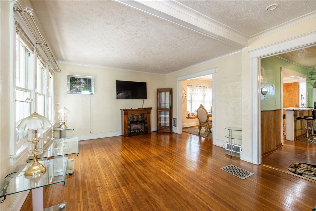 540 Augustine Street Rochester, NY 14613 - Photo 15 of 49 SPACIOUS LIVING ROOM WITH EXPANSIVE WINDOWS & BEAU