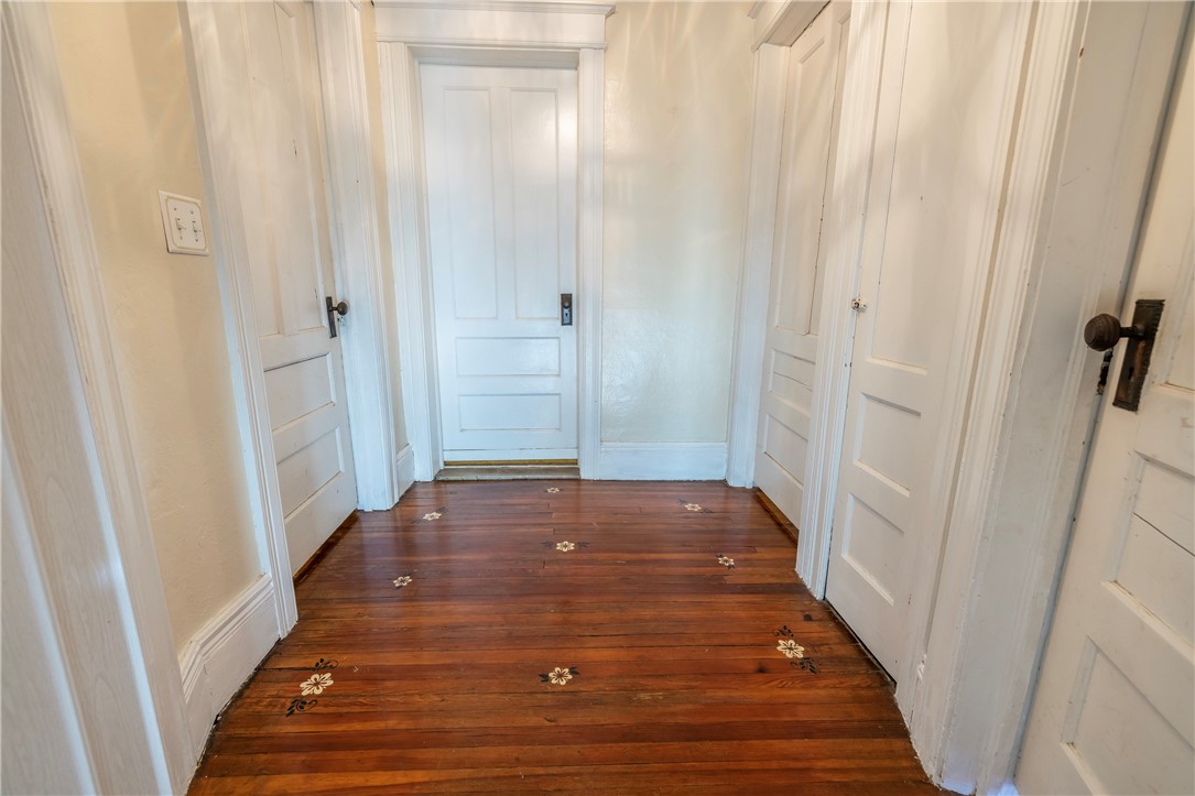 540 Augustine Street Rochester, NY 14613 - Photo 27 of 49 UPSTAIRS LANDING WITH HAND PAINTED FLOWERS ON WOOD