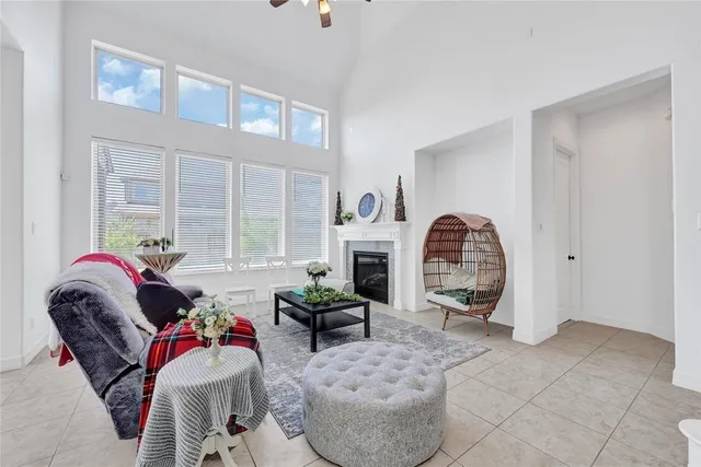 a view of a livingroom with a fireplace and a window