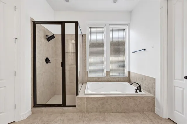a view of walk in closet with wooden floor