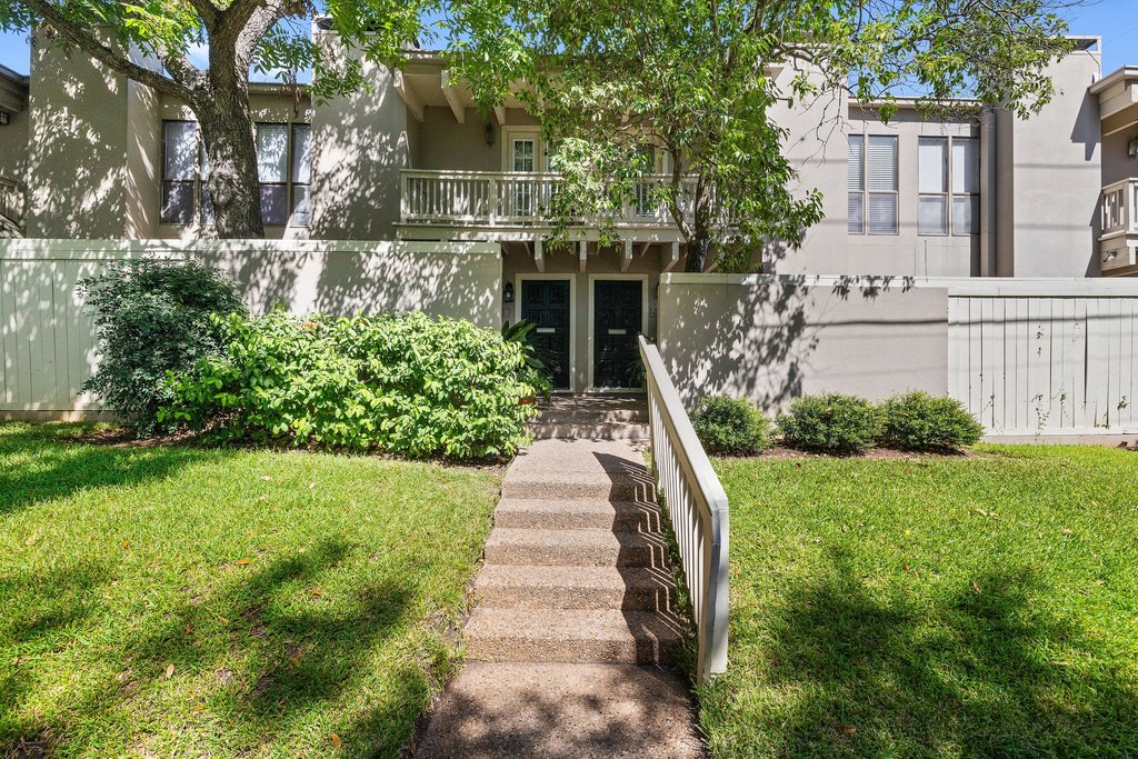 3500 Enfield Road, Unit E Austin, TX 78703 - Photo 2 of 40 Welcoming you under a canopy of trees, this two-story condo captures the coveted "Old Austin" spirit.