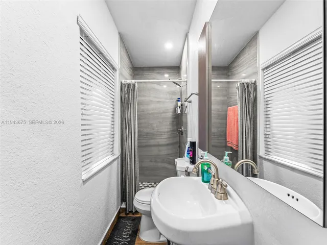 a kitchen with a refrigerator and a table