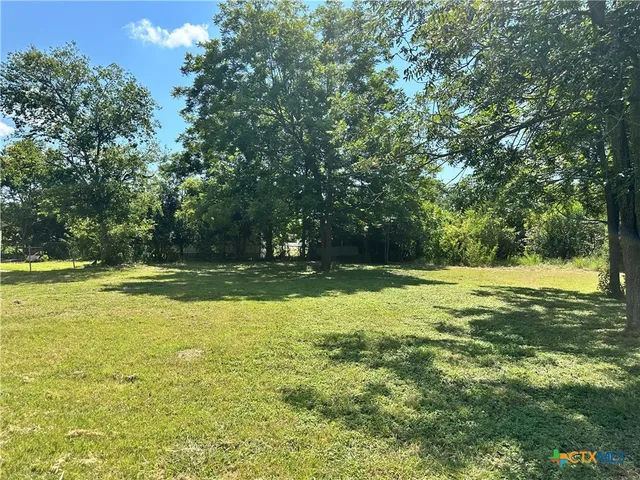 a view of a swimming pool with an outdoor space