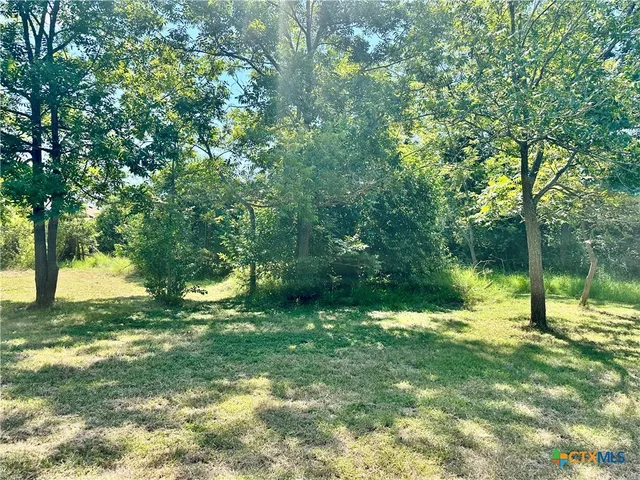 a view of outdoor space with deck and yard
