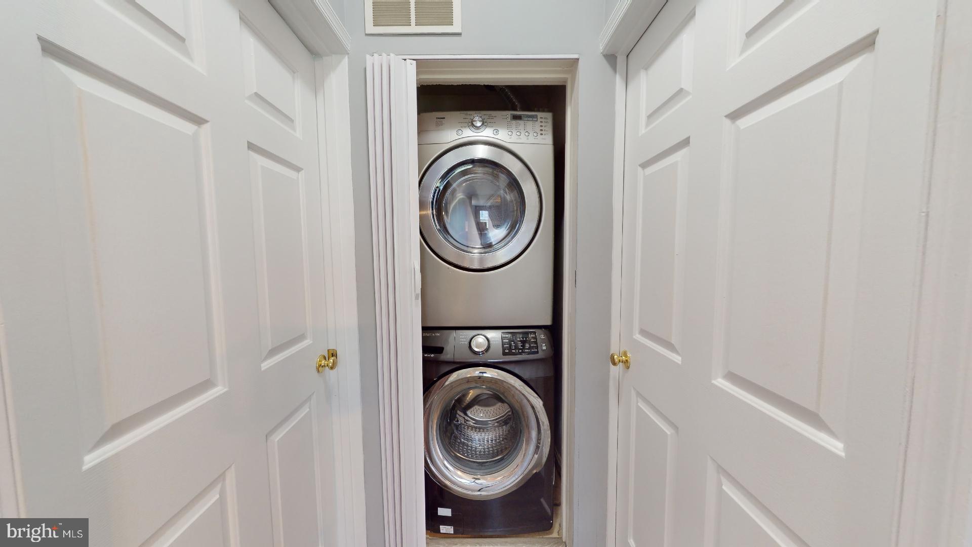 5947 Founders Hill Drive, Unit 103 Alexandria, VA 22310 - Photo 19 of 19 a view of washer and dryer in a utility room