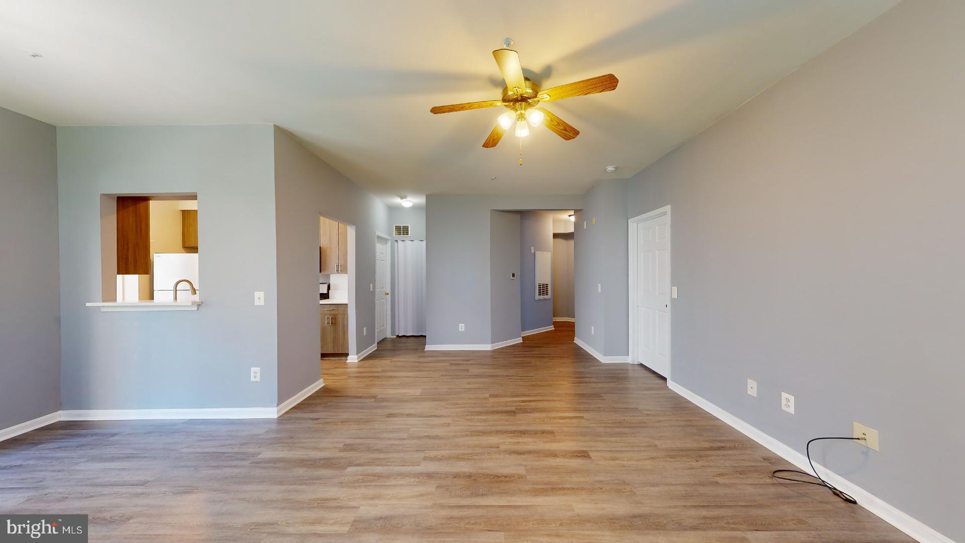 5947 Founders Hill Drive, Unit 103 Alexandria, VA 22310 - Photo 5 of 19 a view of empty room with wooden floor