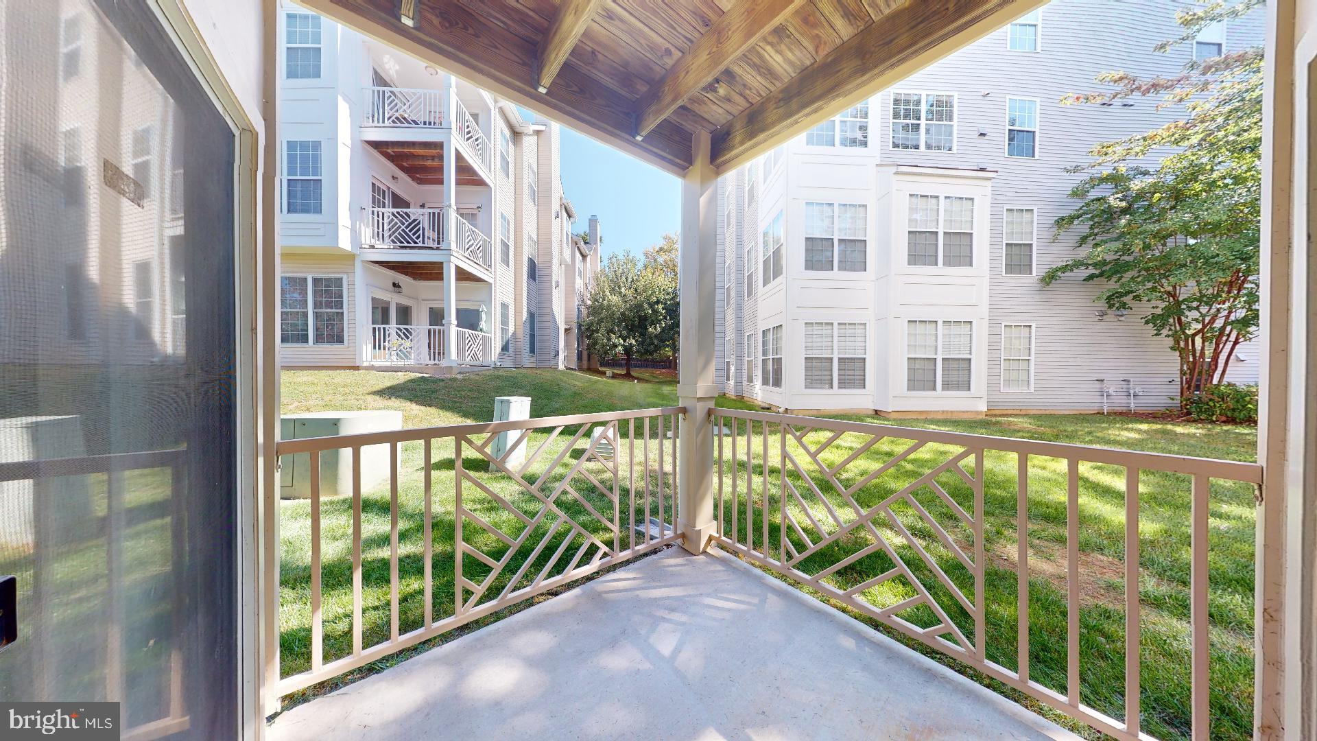 5947 Founders Hill Drive, Unit 103 Alexandria, VA 22310 - Photo 10 of 19 a view of a large building with a swimming pool