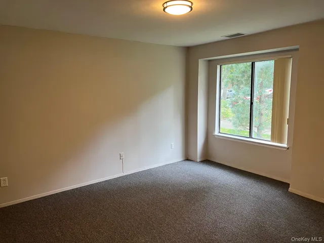 a view of a room that has a window in it