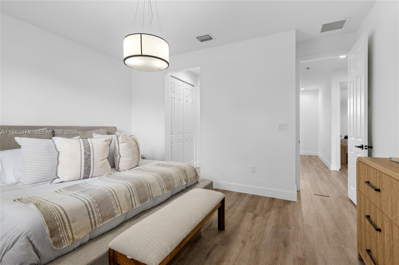 9094 Southwest 36th Street Miramar, FL 33025 - Photo 26 of 50 a bed room with a bed mirror and a night stand