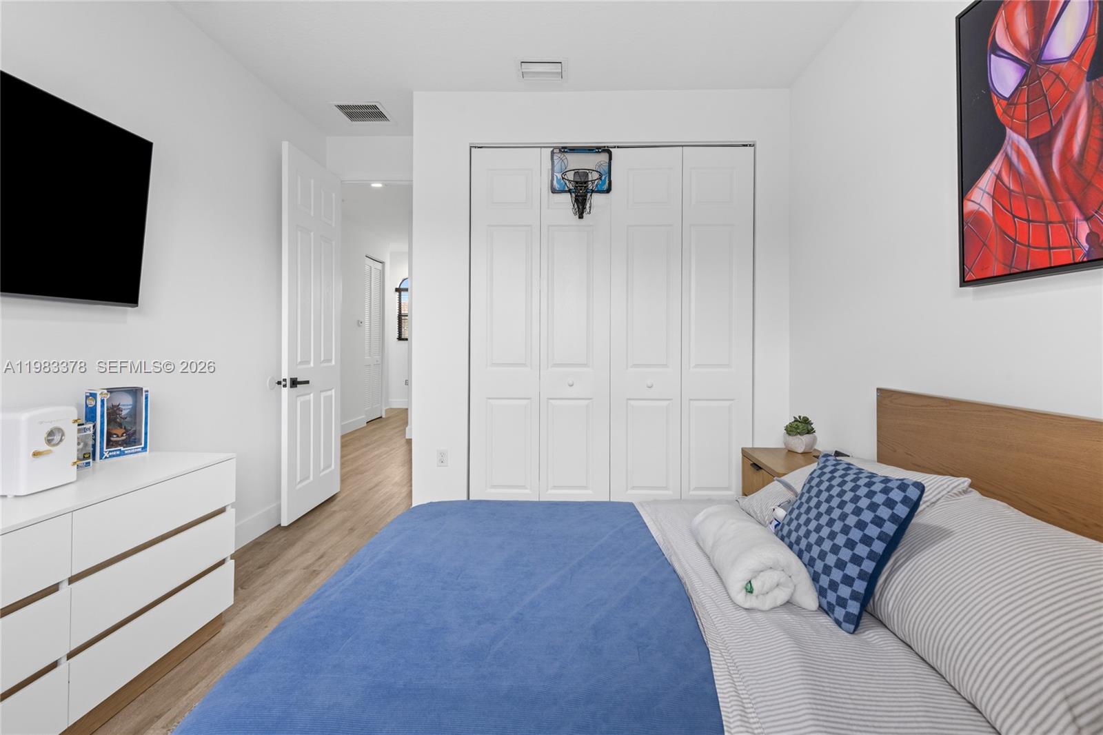 9094 Southwest 36th Street Miramar, FL 33025 - Photo 32 of 50 a bedroom with a bed and a flat screen tv