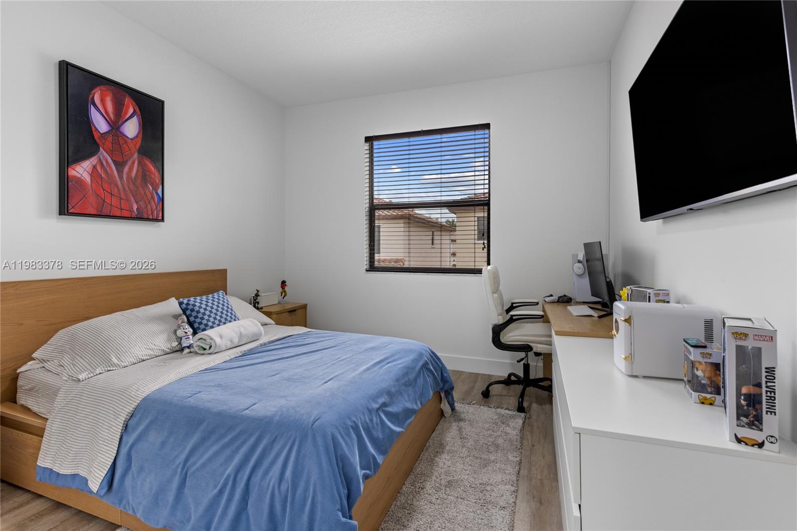 9094 Southwest 36th Street Miramar, FL 33025 - Photo 33 of 50 a bedroom with bed and a flat screen tv