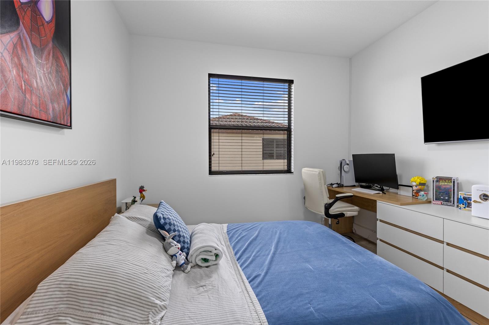 9094 Southwest 36th Street Miramar, FL 33025 - Photo 34 of 50 a bedroom with a workspace