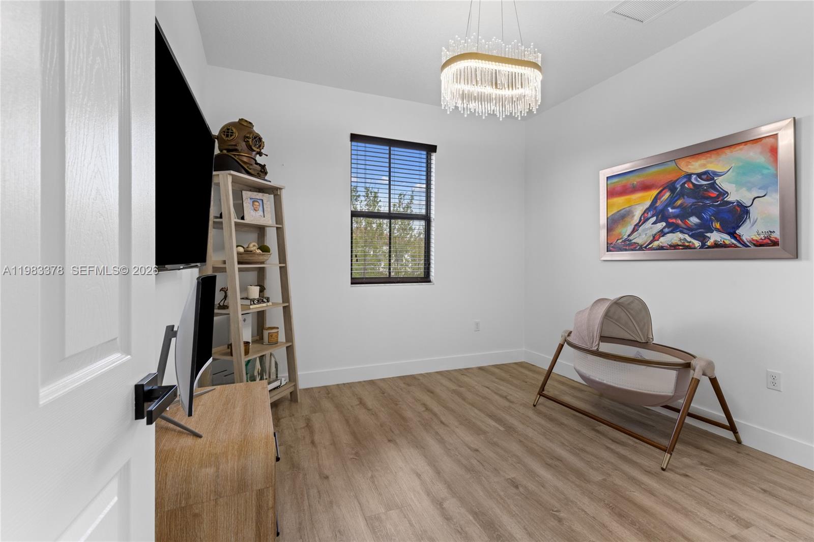 9094 Southwest 36th Street Miramar, FL 33025 - Photo 36 of 50 a view of a workspace with furniture and wooden floor
