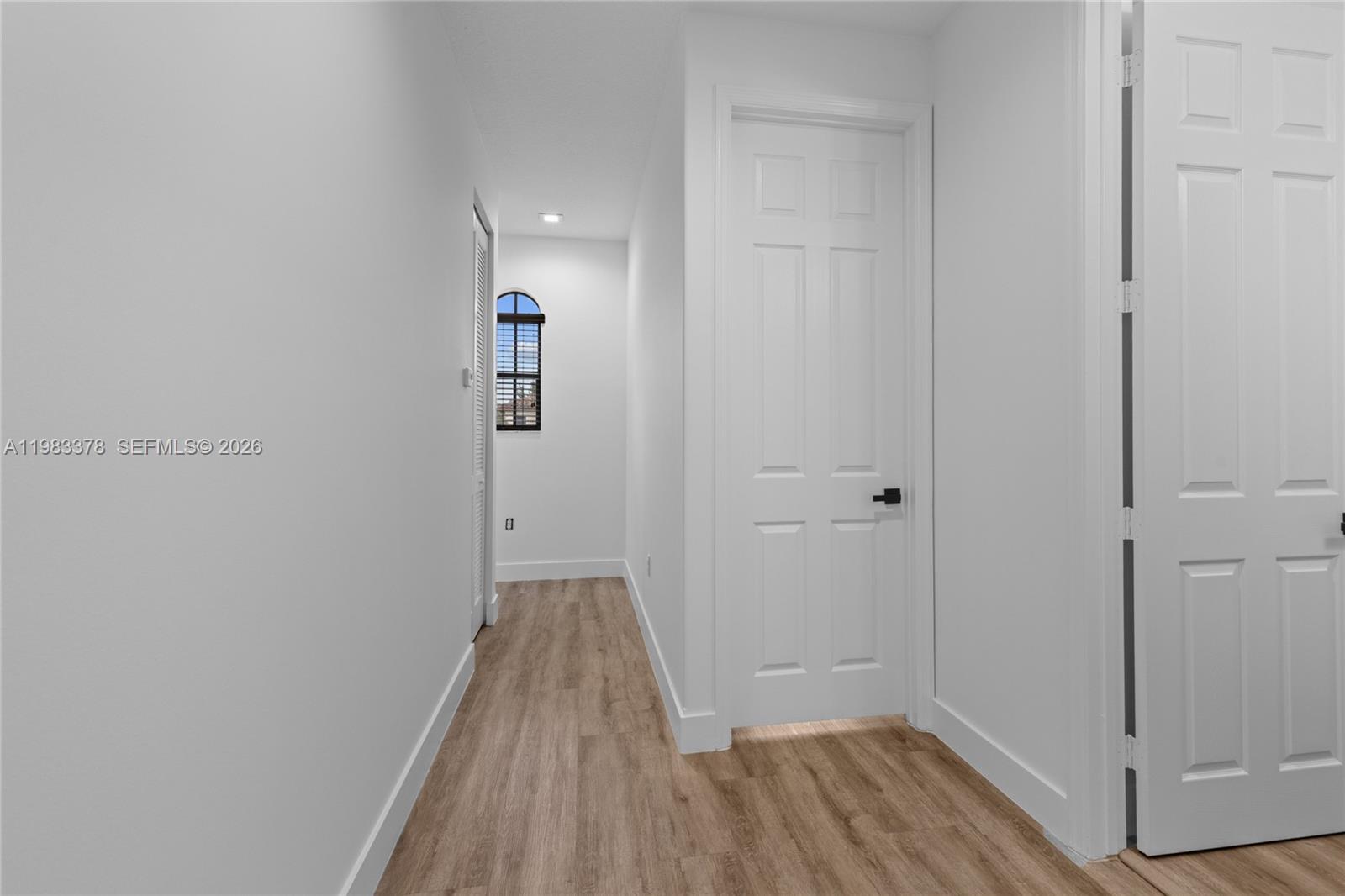 9094 Southwest 36th Street Miramar, FL 33025 - Photo 39 of 50 a view of a hallway with wooden floor and closet