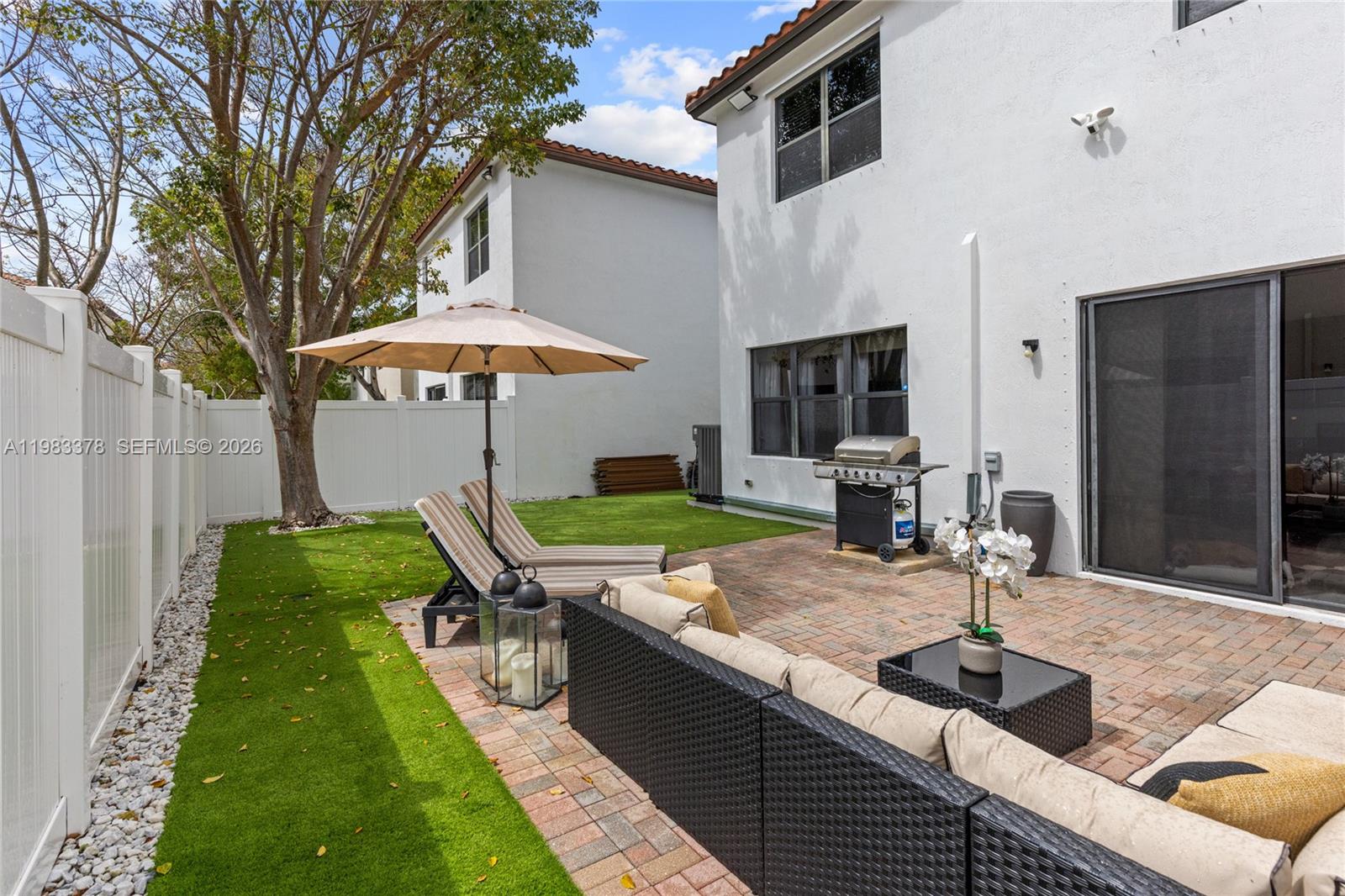 9094 Southwest 36th Street Miramar, FL 33025 - Photo 41 of 50 a patio with table and chairs