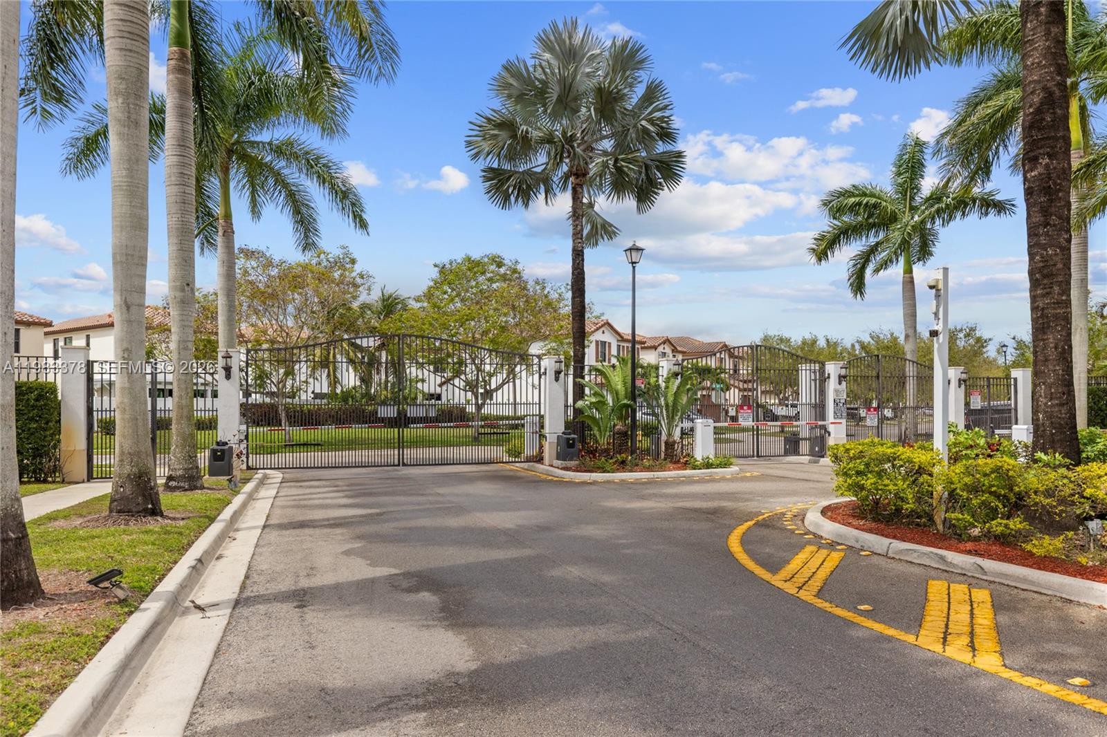 9094 Southwest 36th Street Miramar, FL 33025 - Photo 50 of 50 a view of a swimming pool with a lawn chairs and palm trees