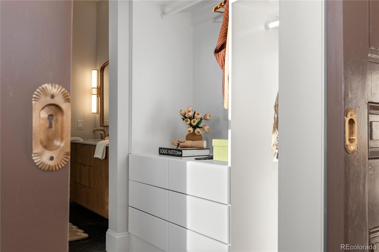 817 29th Street Denver, CO 80205 - Photo 12 of 33 a bathroom with a sink and mirror
