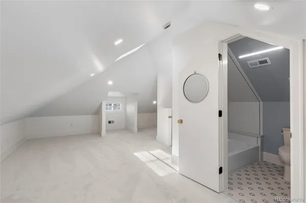 a view of a room with wooden floor and glass door