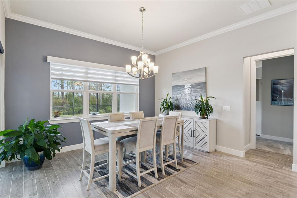 2745 Nature Vw Road St. Cloud, FL 34771 - Photo 12 of 50 a view of a dining room with furniture window and wooden floor
