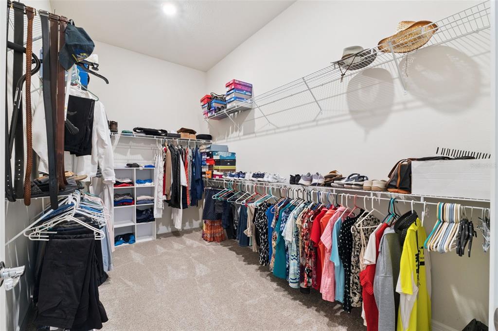 2745 Nature Vw Road St. Cloud, FL 34771 - Photo 19 of 50 a view of walk in closet with clothes and shoes