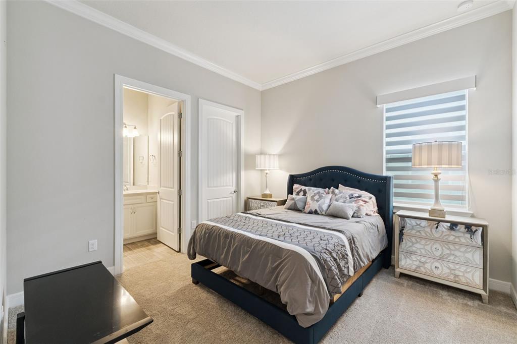 2745 Nature Vw Road St. Cloud, FL 34771 - Photo 21 of 50 a bedroom with a bed and a night stand