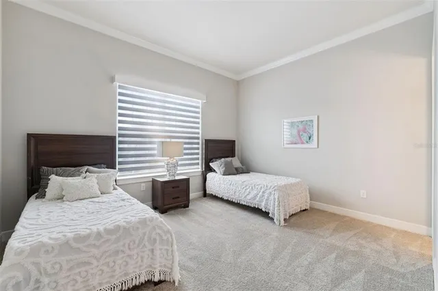 a bedroom with bed and a window