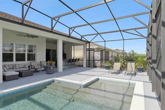 a building outdoor space with patio furniture and potted plant